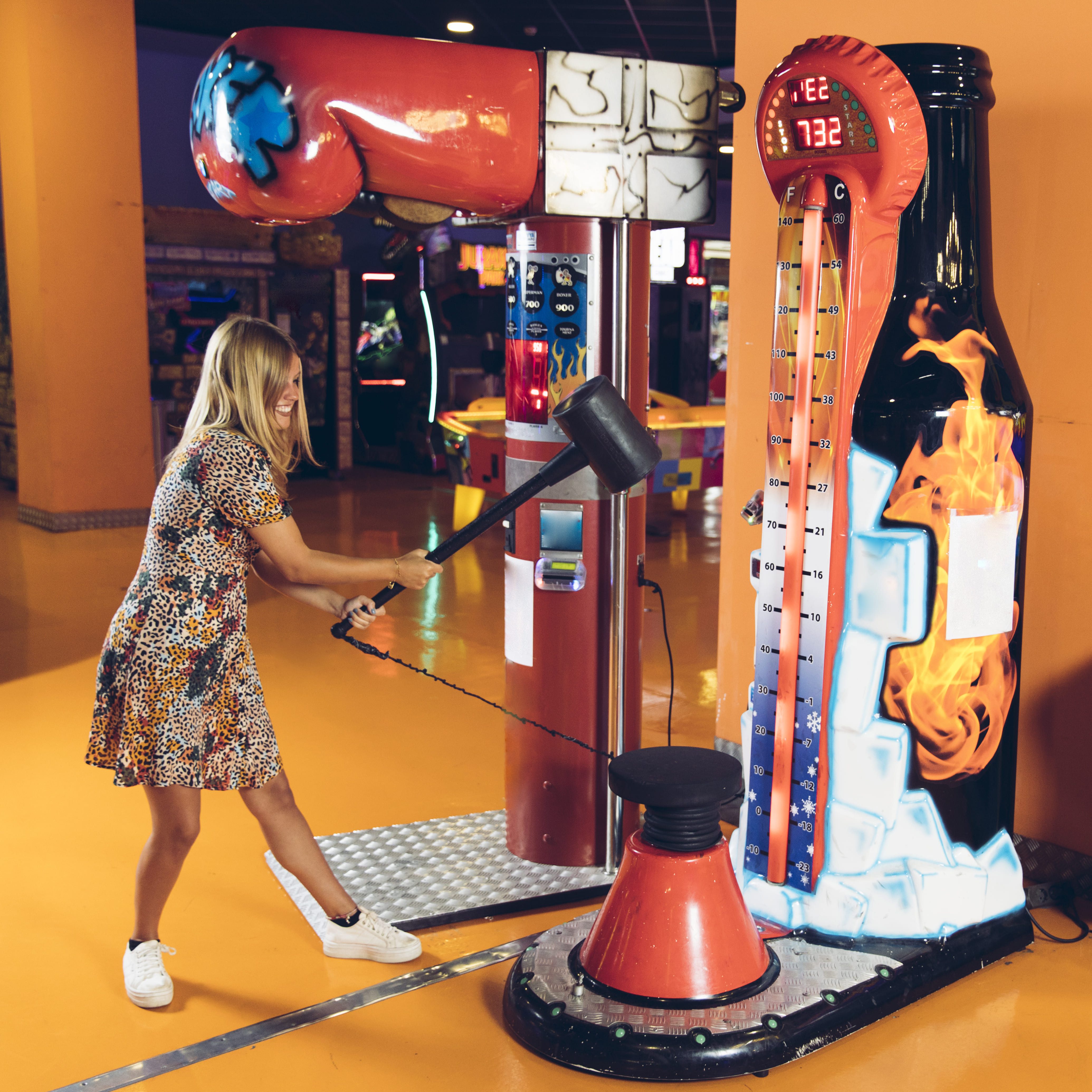 happy-woman-playing-arcade-game