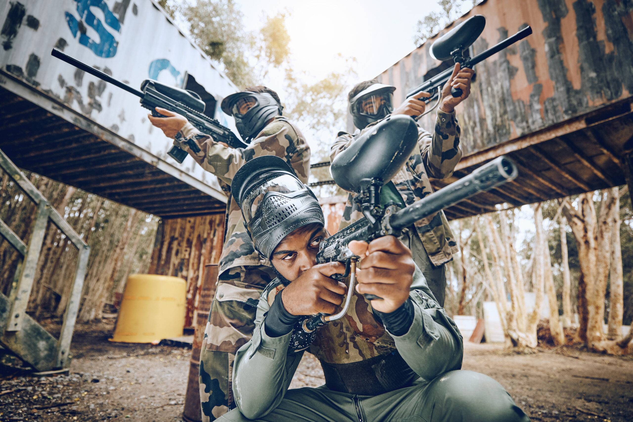paintball-teamwork-shooting-together-war-game-with-vision-mask-tactical-strategy-safety-competition-military-training-team-building-group-with-weapon-combat-friends-outdoor